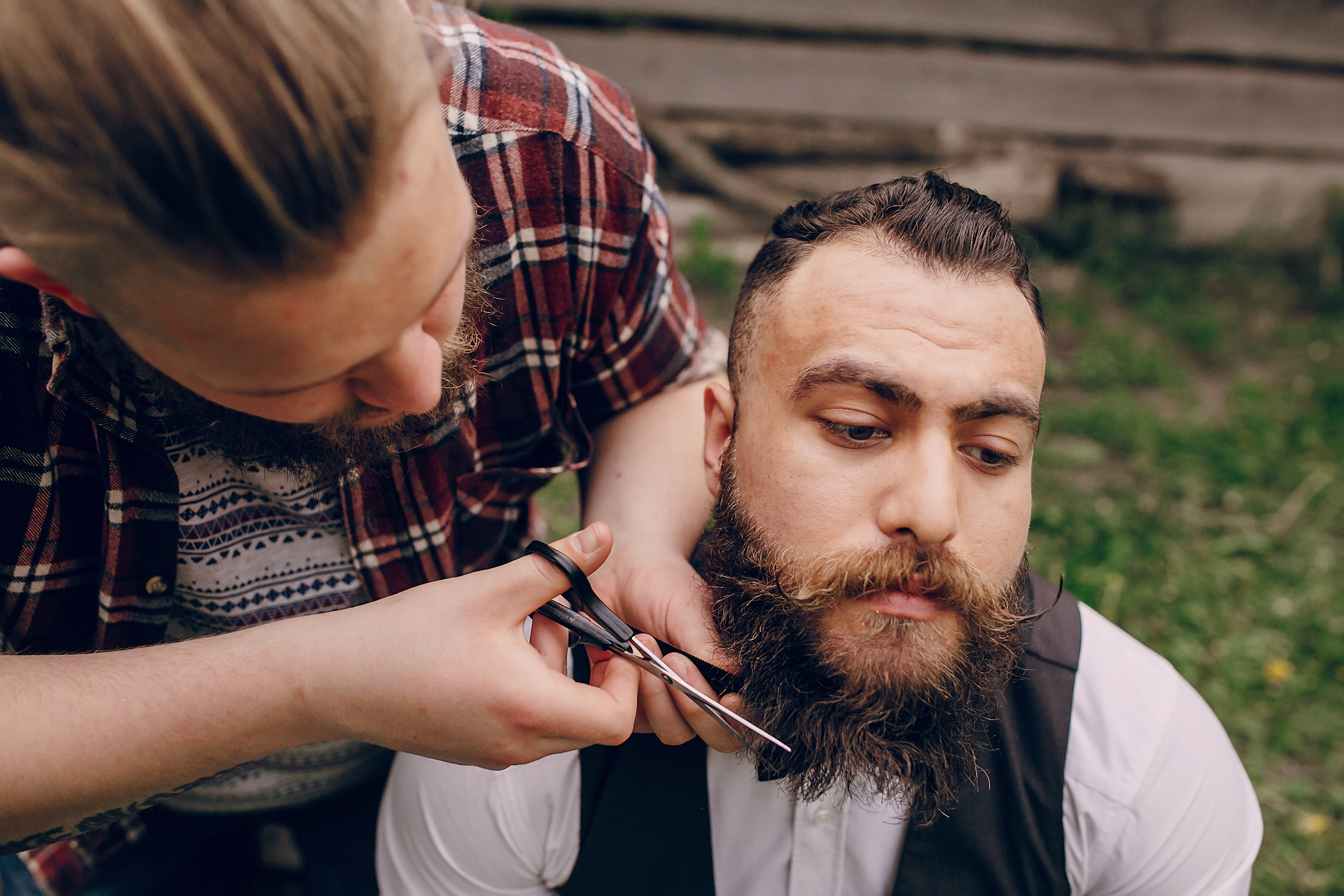 two bearded men shave